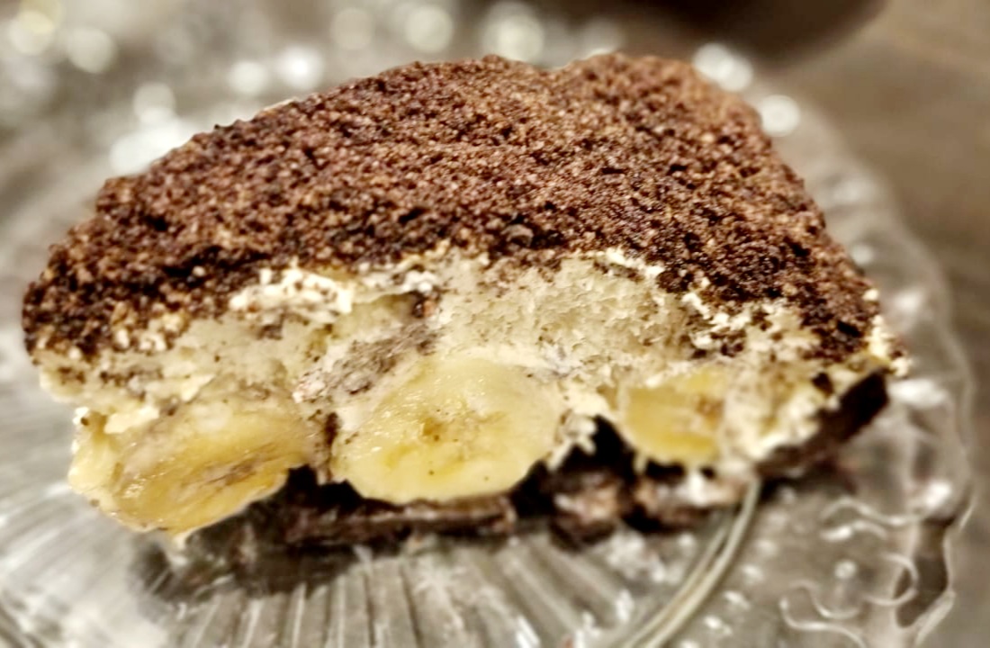 a piece of cake with bananas on top